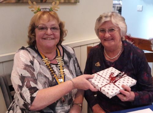 two ladies with a gift